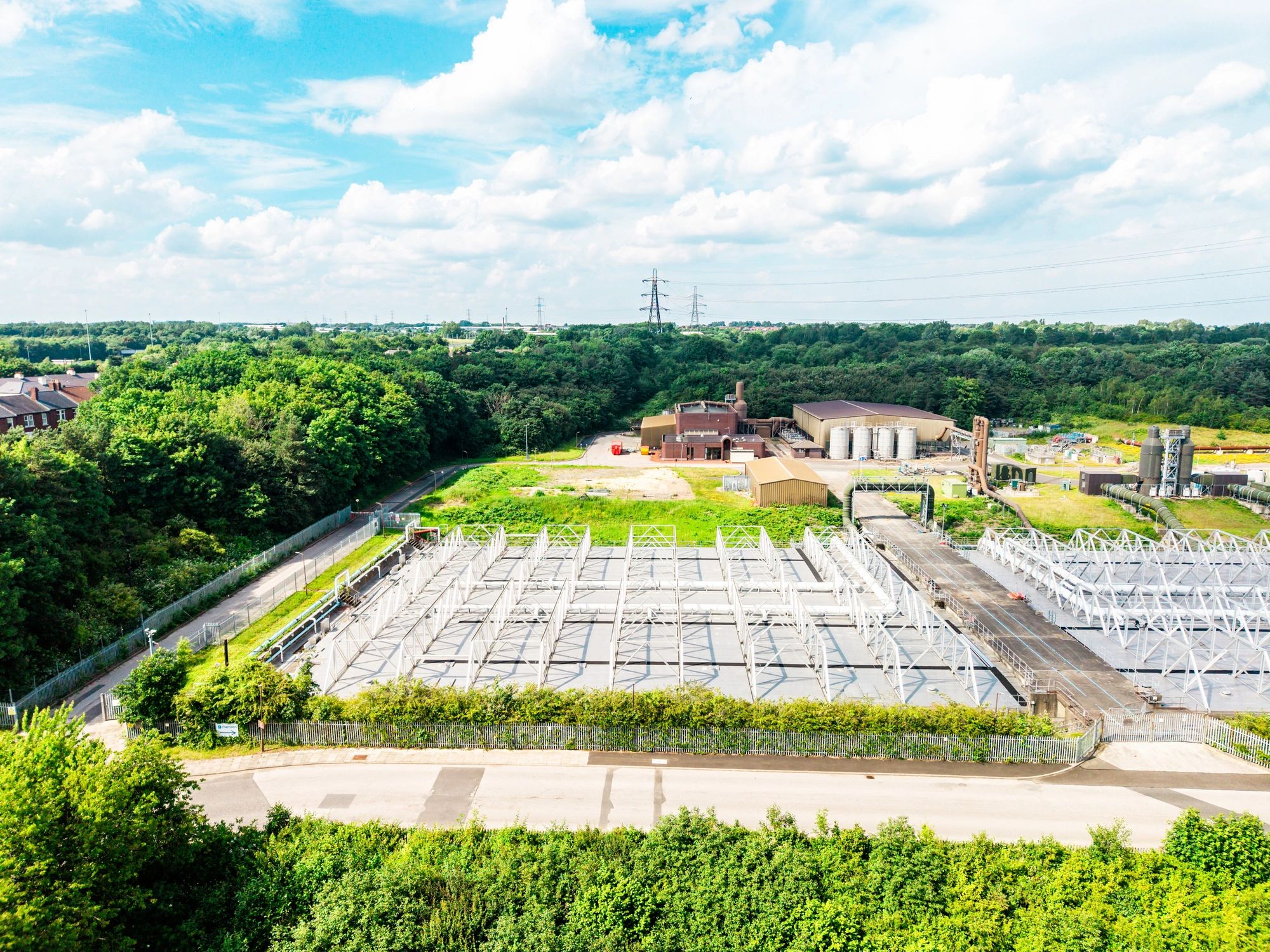 Industrial facility landscape with infrastructure and green surroundings